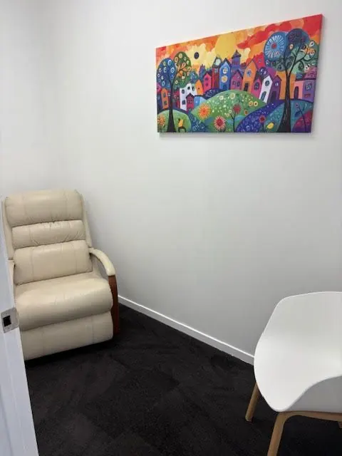 Consult room at the Silverdale clinic with a colourful artwork on the wall